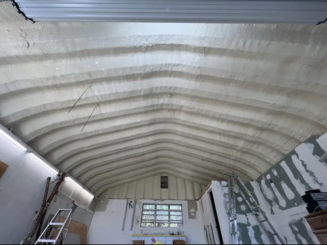 Spray polyurethane foam applied to the underside of a metal roof deck in Hornsby Bend
